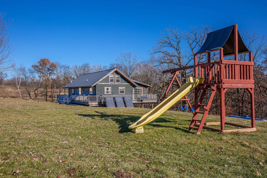 Outside view of a house with a slide for kids