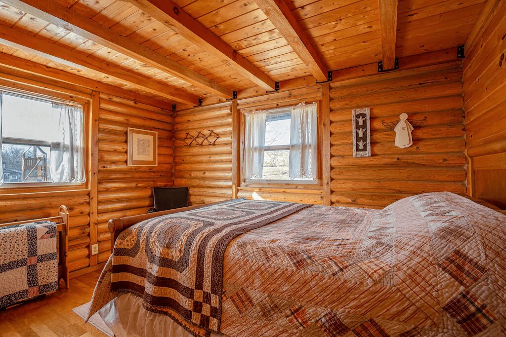 bed inside a wooden room